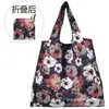 Bolsa de almacenamiento portátil para supermercado de exportación en stock mediana bolsa de compras bolsa de protección ambiental bolso de mano bolsa de compras plegable nailon