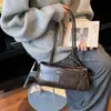 Bolso de Hombro Minimalista Retro de Nicho para Mujer 2026 Elegante Nuevo Estilo Versátil para el Trabajo Bolso Baguette