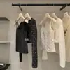 Conjunto de dos piezas Y.JIA Otoño estilo coreano cárdigan floral suave corto de manga larga + camisola 2621