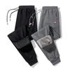Pantalones deportivos de algodón puro nuevos de primavera y otoño para hombre, pantalones casuales, etiqueta de tres colores, cremallera, holgados, rectos, pantalones de chándal para hombre