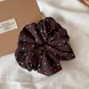 Goma para el pelo de lunares blancos y negros estilo coreano para mujer 2026 Nuevo Accesorios para el Cabello Flor para Recogido Parcial