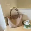 Bolsa de Gran Capacidad para Mujer 2026 Nueva Tendencia Ligera de Tela Bolso de Hombro Único Bolso Tote de Moda Casual para el Trabajo