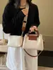 Tendencia transfronteriza 2026 nuevo modelo de bolso madre-hija, bolso de hombro y cruzado moderno y versátil, bolso cubo de mano de nicho con textura