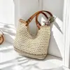 Bolso de mano tejido a mano artístico calado de nicho transfronterizo, bolso de hombro versátil, bolso de playa de gran capacidad para vacaciones junto al mar