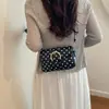 Bolso de mujer de alta gama 2026 verano nuevo bolso de hombro para el trabajo, bolso de hombro cruzado de diseño de nicho moderno y simple
