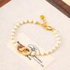 Pulsera minimalista japonesa y coreana de doble anillo redondo con incrustaciones de diamantes y perlas para mujer, lujo ligero de alta gama, versátil, nicho, con cuentas, venta al por mayor