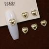 Nuevos accesorios de aleación para decoración de uñas con forma de corazón torcido tridimensional liso con diseño de amor hueco retro japonés