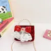 Bolsa de Ano Novo Infantil Estilo Ocidental Desenho Animado Lantejoula Laço Mini Bolsa de Mão Pérola Chanel Bolsa Tiracolo de Ano Novo