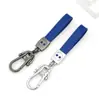 Llavero de piel de cordero transfronterizo para coche con logo de coche de resina, colgante de llave para hombres de negocios, al por mayor en stock