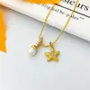 Estilo casual europeo y americano dulce collar de perlas de agua dulce con estrella de mar lindo doble colgante con microincrustaciones de circón cadena para la clavícula llamativa femenina