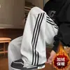 Pantalones largos casuales rectos a rayas estilo americano para hombre, otoño e invierno, forrados de polar, modernos, retro, holgados, de pierna ancha, pants deportivos