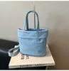 Bolsa para Teléfono Móvil 2026 Verano Nuevo Estilo Linda Bolsa de Tela de Nylon Moda Simple de Mano Cruzada Pequeña Tote Cubo para Mujer