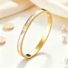 Pulsera versátil de moda transfronteriza con diamantes completos para mujer, pulsera de acero de titanio chapada en oro con extremo abierto, disponible en varios colores