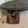Bolso de Mano Retro Estilo Coreano para Mujer Otoño 2026 Nueva Moda Simple de Hombro Único Bolso de Axila Bolso de Mano para el Trabajo y el Trayecto