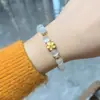 Pulsera de Ojo de Gato Natural adorno de lazo diseño de pequeñas cuentas de transferencia pulsera segura y de buena suerte diseño simple de lujo ligero