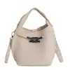 Bolsos Pequeños Transfronterizos para Mujer 2025 Nuevo Color Sólido Bolso Tipo Kelly Bolso Popular Bolso Cubo Bolso de Hombro Cruzado de Nicho