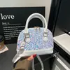 Design de lantejoulas estilo coreano transfronteiriço, moda doce e cool, nova bolsa de ombro casual de grande capacidade 2026