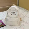 Nova mochila casual de alta aparência para alunos do ensino fundamental e médio, bolsa escolar leve e versátil para meninas, mochila de viagem com desenho animado