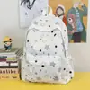 Bolso de hombro doble tipo estrella de alta gama con ambiente estilo bosque versión coreana moderno pequeño fresco estudiante ligero gran capacidad mochila escolar