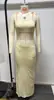 Verano 2025 Nuevo Traje Sexy de Dos Piezas con Falda Larga y Top Halter Ajustado al Cuerpo Estilo Europeo y Americano Estación Independiente Transfronteriza para Mujer