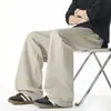 Pantalones largos casuales de corte holgado en gris avena para hombre, pantalones versátiles de pierna recta para otoño, pantalones deportivos retro americanos con una caída moderna