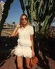 Ropa Europea y Americana para Mujer Transfronteriza Aliexpress Ins Conjunto de Chaqueta de Punto de Manga Corta con Borlas + Minifalda de Cintura Alta