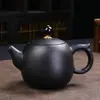 Juego de té de cerámica negra estilo japonés traje de té tetera vintage con asa lateral oferta especial regalo caja de regalo exquisita juego de cerámica Dehua