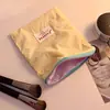 Linda bolsa de almacenamiento, bolsa de cosméticos estilo macarrón para mujer, nuevo modelo 2026, bolsa portátil para toallas sanitarias, bolsa de almacenamiento pequeña, monedero