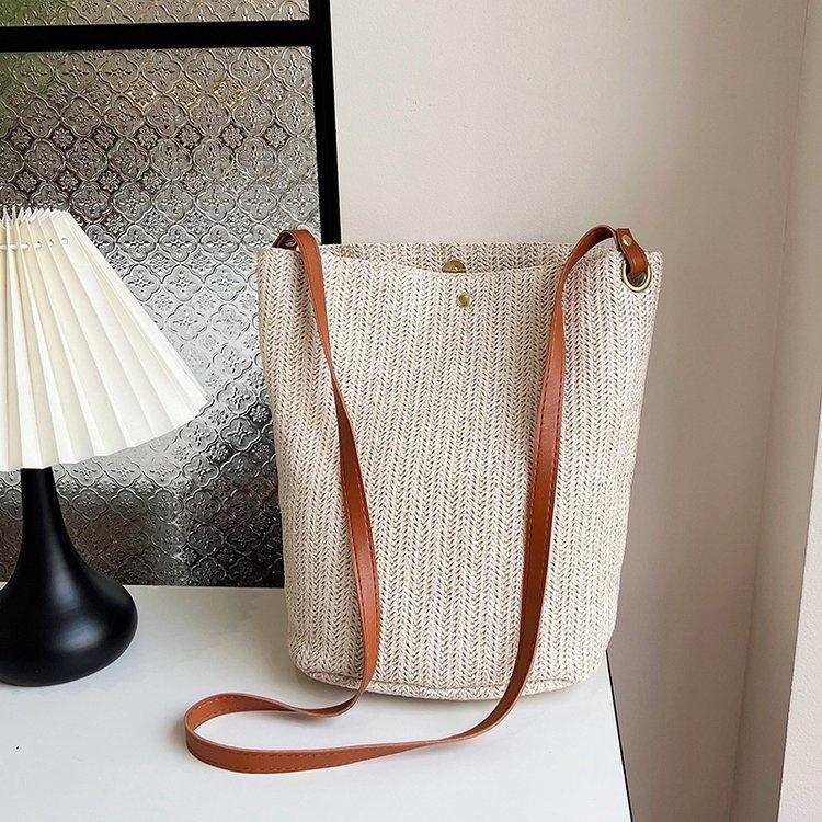 编织包女包新款潮2024夏草编简约百搭小清新水桶包个性单肩斜