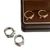 Brincos de Nó de Corda Dourada 2026 para Mulheres, Design de Nicho de Luxo Leve, Temperamento Único de Alta Qualidade, Brincos de Clipe Únicos, Novos Brincos no Atacado