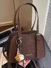 Bolso tipo almohada liso de color sólido casual transfronterizo para mujer 2025 Otoño Nueva Moda Bolso de axila Bolso de hombro de nicho moderno