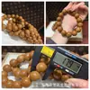 El fabricante suministra una colección de pulseras de hueso de durazno naturales, pulseras de hueso de durazno de círculo único para hombres y mujeres, populares en Xiaohongshu, con diseño de agujero pasante