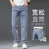 Jeans masculinos de outono novos de alta qualidade, corte reto solto, tamanho grande, confortáveis e elásticos, calças de alta qualidade de Guangzhou Xintang