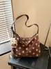 Bolso de mujer de gran capacidad 2026 nuevo bolso de moda casual para principios de otoño para la escuela y el trabajo, bolso tipo albóndiga de hombro y cruzado