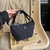 Bolsa de Lona para Mujer Verano 2024 Nueva Moda de Nicho Simple Bolso de Hombro Cruzado Bolso de Mujer de Gama Alta Tipo Empanada