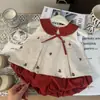 Ropa Infantil Estilo Coreano 2026 Nuevo Verano Conjunto de Dos Piezas para Niñas: Top a Cuadros Bordado con Cuello de Muñeca y Shorts Florales