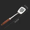 Espátula de acero inoxidable 304 cuchara para sopa espátula para cocinar en casa nuevo mango de madera juego de utensilios de cocina concha para sopa grande venta al por mayor