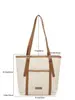 Nuevo bolso de gran capacidad para principios de otoño de 2026, bolso de hombro versátil y moderno para el trabajo, bolso tote casual vintage, bolso de mujer al por mayor