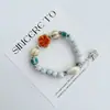 Pulsera de Cerámica Jingdezhen Nueva Historieta China Pulsera Boutique Venta al por Mayor Estudiante Joker Explosiones Puesto del Mercado Nocturno Pulsera