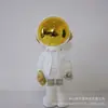 Venta Caliente Lujo Ligero Chapado en Oro Astronauta Adornos de Pie Creativo Astronauta Decoración de Sala de Estar Moderno Simple Entrada TV