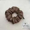 Gomas para el cabello brillantes y lustrosas estilo coreano para mujer, con un diseño plisado, material elástico que no daña el cabello y un aspecto de alta gama para coletas.
