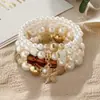 Produto popular de travessia de fronteira europeu e americano: Pulseira com pingente de estrela-do-mar estilo boho, pulseira de contas com cordão elástico multicamadas