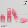 Jinze Pedido Tubo Rosa Degradado Corazón Hueco Tapa Gruesa Pincel Grueso Tubo de Brillo de Labios con Cadena/Sin Cadena Material de Empaque de Plástico