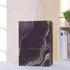 Bolsa de papel de mano al por mayor de fábrica, bolsa de papel Kraft, bolsa de regalo para fiestas, bolsa de dulces personalizada