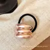 Diseño de nicho personalidad sentido del metal cóncavo-convexo elástico para el cabello versátil estilo frío cuerda para el cabello europea y americana corbata de pelo con temperamento retro