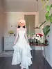 Vestido de longitud de pastel estilo resort de playa 2026 Verano Nuevo Estilo Francés Blanco con Volantes de Satén con Tirantes para Mujer