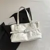 Bolsa de mano de nicho transfronteriza para mujer, nuevo modelo 2026, bolso de mano de alta gama versátil de gran capacidad para el día a día, bolso de hombro, bolso de axila