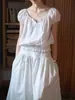 Top de Manga Corta Stamack con Cordones de Encaje de Lino Lavado con Lluvia y Rocío SS2025