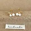 Elegantes Pendientes de Botón de Perla Brillante de Lujo de Nicho con Temperamento de Alta Gama y Diseño Único para el Viaje Versátiles Exquisitos Pendientes