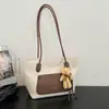 Bloqueo de Color Transfronterizo Gran Capacidad Verano 2026 Nuevo Elegante Versátil Temperamento Simple Alta Apariencia Hombro Cruzado de Mano Bolso Tote